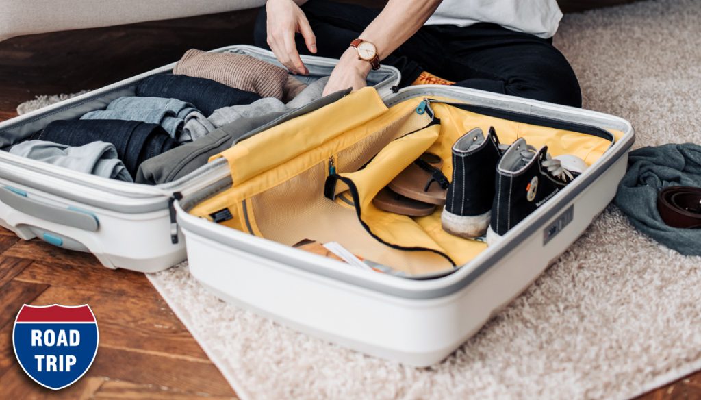 Suite case being packed, clothes & shoes