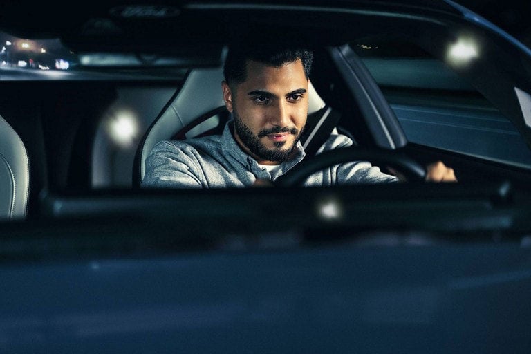 Person sitting in the driver’s seat of a parked 2024 Ford Mustang® coupe | Tubbs Brothers, Inc in Sandusky MI