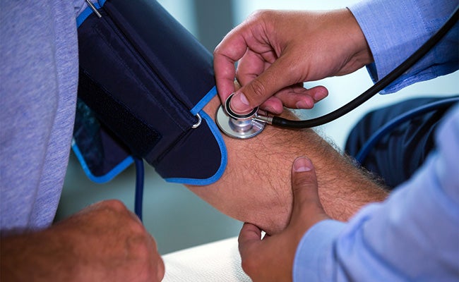 Man getting blood pressure checked